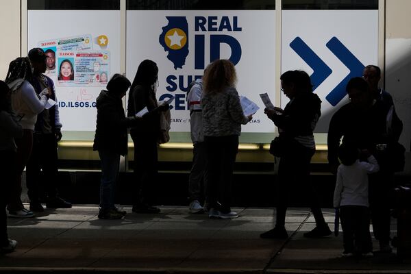 People line up to apply for Real ID at a Real ID Supercenter in downtown Chicago, Tuesday, May 6, 2025. (AP Photo/Kiichiro Sato)