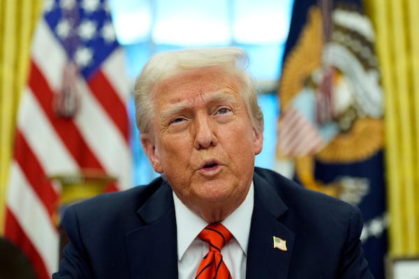 President Donald Trump speaks with reporters as he signs an executive order in the Oval Office at the White House, Monday, Feb. 10, 2025, in Washington. (Photo/Alex Brandon)