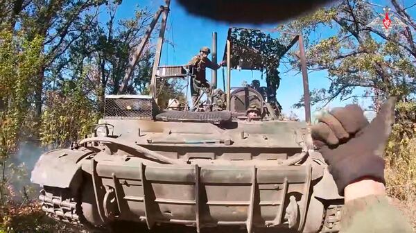 In this photo taken from video released by Russian Defense Ministry Press Service on Tuesday, May 6, 2025, a Russian 'Tyulpan' self-propelled heavy mortar takes a position to fire towards Ukrainian positions on an undisclosed location in Ukraine. (Russian Defense Ministry Press Service via AP)