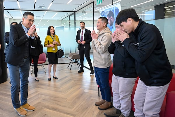 In this image released by Thailand Foreign Ministry, Thailand's Foreign Minister Maris Sangiampongsa, left, meet Thai hostages who were freed from Hamas, Pongsak Thaenna, Bannawat Saethao, Watchara Sriaoun, in Israel, Saturday, Feb. 1, 2025. (Thailand Foreign Ministry via AP)