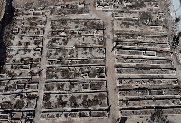 An arial view shows a mass grave where are buried those who were killed by the sarin struck during a 2013 chemical weapons attack that was blamed on then President Bashar Assad's forces, in Zamalka neighbourhood, on the outskirts of Damascus, Syria, Wednesday, Dec. 25, 2024. (AP Photo/Hussein Malla)