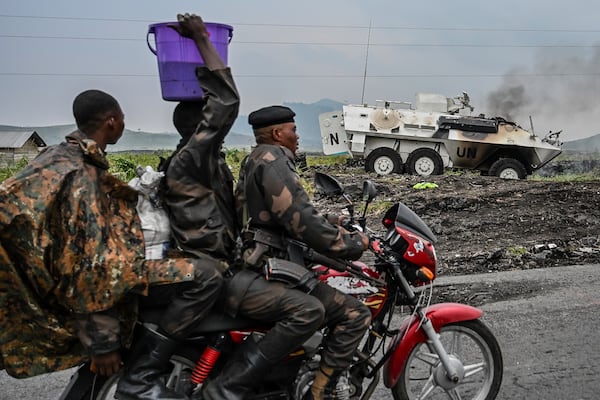 A UN armoured personnel carrier burns during clashes with M23 rebels outside Goma, Democratic Republic of the Congo, Saturday, Jan. 25, 2024. (AP Photo/Moses Sawasawa)