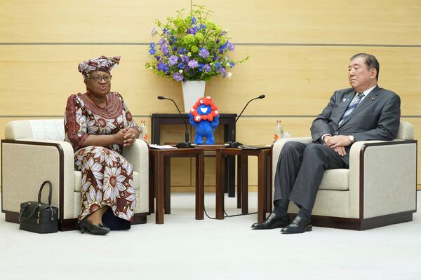World Trade Organization (WTO) Director-General Ngozi Okonjo-Iweala, left, meets with Japan's Prime Minister Shigeru Ishiba at the latter's office in Tokyo Tuesday, May 13, 2025. (Kazuhiro Nogi/Pool Photo via AP)