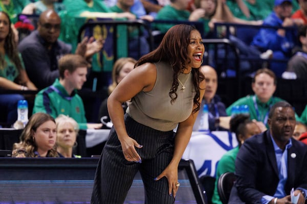 Notre Dame head coach Niele Ivey shouts to her team during the second half of an NCAA college basketball game against Duke in the semifinals of the Atlantic Coast Conference tournament in Greensboro, N.C., Saturday, March 8, 2025. (AP Photo/Ben McKeown)