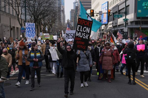 Protesters demonstrate against Project 2025, in Philadelphia, Wednesday, Feb. 5, 2025. (AP Photo/Matt Rourke)