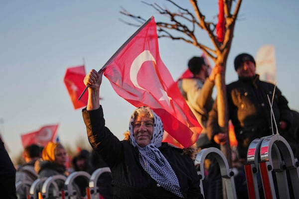 People gather outside the City Hall to protest the arrest of Istanbul Mayor Ekrem Imamoglu in Istanbul, Turkey, Wednesday, March 19, 2025. (AP Photo/Francisco Seco)