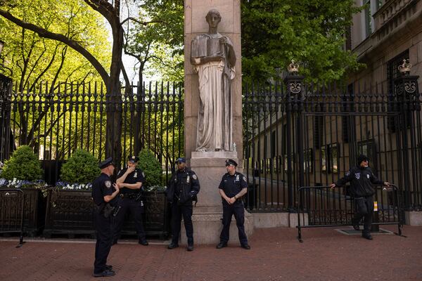 FILE - Police officers stand guard outside Columbia University, Thursday, May 2, 2024, in New York. (AP Photo/Yuki Iwamura, File)