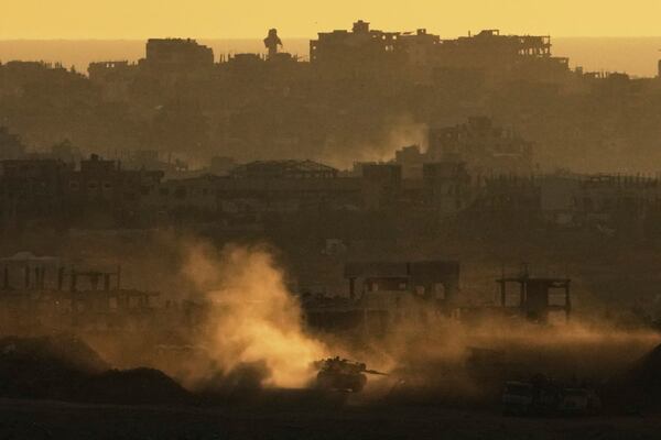 An Israeli army tank maneuvers in the Gaza Strip is seen from southern Israel, Sunday, May 4, 2025. (AP Photo/Ariel Schalit)