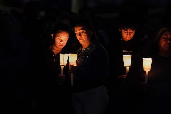 People attend a vigil for slain Native American teen Emily Pike in Mesa, Ariz., Thursday, March 6, 2025. (AP Photo/Samantha Chow)