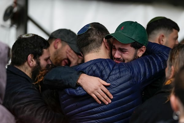 Mourners of 1st Sgt. Yuval Shoham attend his funeral at the Mount Herzl military cemetery in Jerusalem, Monday, Dec. 30, 2024. (AP Photo/Matias Delacroix)