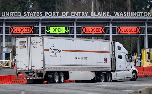 A truck drives past the passenger entry point at the United States and Canada border in Surrey B.C., on Tuesday, March 4, 2025. (Ethan Cairns /The Canadian Press via AP)