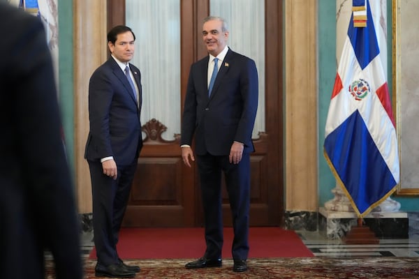 U.S. Secretary of State Marco Rubio, left, stands with Dominican Republic President Luis Abinader at the end of their joint news conference at the National Palace in Santo Domingo, Dominican Republic, Thursday, Feb. 6, 2025. (AP Photo/Mark Schiefelbein, Pool)