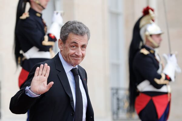 FILE - Former French President Nicolas Sarkozy leaves the Elysee Palace after a lunch with heads of states and officials, Monday, Sept. 30, 2019 in Paris. (AP Photo/Kamil Zihnioglu, File)