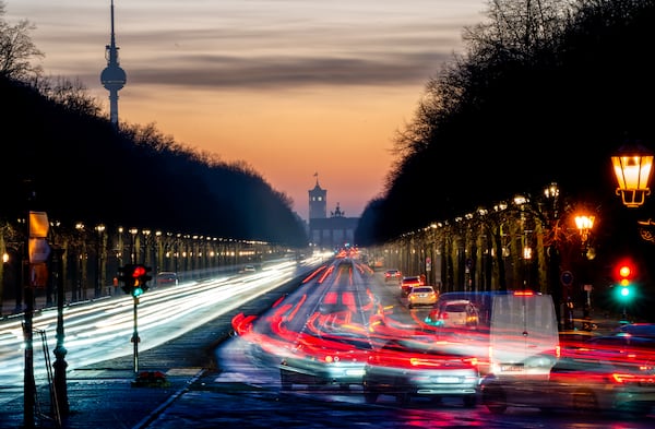 Cars move towards the Brandenburg Gate on the 17th of June Street in Berlin , Germany, Monday, Feb. 24, 2025, the day after the German election. (AP Photo/Michael Probst)