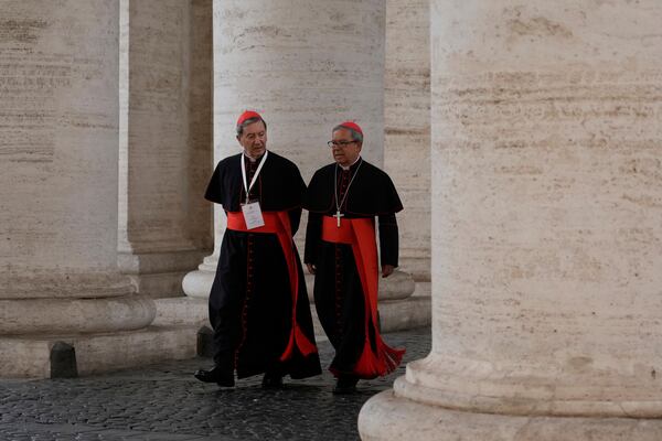 Cardinals Ruben Salazar Gomez, left is flanked by Cardinal Luis José Rueda Aparicio as they arrive in the New Hall of the Synod at the Vatican, Tuesday, May 6, 2025, the last time before the start of the conclave starting in the afternoon of Wenesday, May 7, when they will elect the successor of Pope Francis. (AP Photo/Gregorio Borgia)