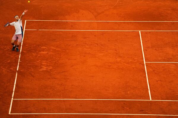 Norway's Casper Ruud serves to Britain's Jack Draper during the Madrid Open tennis final in Madrid, Spain, Sunday, May 4, 2025. (AP Photo/Manu Fernandez)