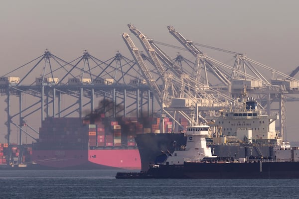 Pollution rises from a ship cruising by the Port of Long Beach where tankers and container ships enter and exit, Monday, March 10, 2025, in San Pedro, Calif. (AP Photo/Etienne Laurent)