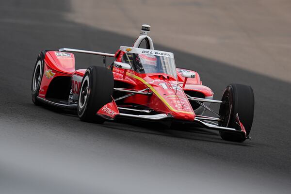 Will Power, of Australia, drives through the first turn during practice for the Indianapolis 500 auto race at Indianapolis Motor Speedway in Indianapolis, Thursday, May 15, 2025. (AP Photo/Michael Conroy)