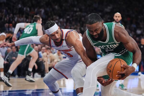 Boston Celtics' Jaylen Brown (7) fights for control of the ball with New York Knicks' Josh Hart (3) during the first half of Game 6 in the Eastern Conference semifinals of the NBA basketball playoffs Friday, May 16, 2025, in New York. (AP Photo/Frank Franklin II)