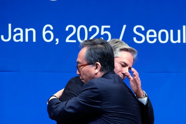 U.S. Secretary of State Antony Blinken, back, and South Korean Foreign Minister Cho Tae-yul, front, embrace each other after a joint press conference following their meeting at the Foreign Ministry in Seoul, South Korea, Monday, Jan. 6, 2025. (AP Photo/Lee Jin-man, Pool)