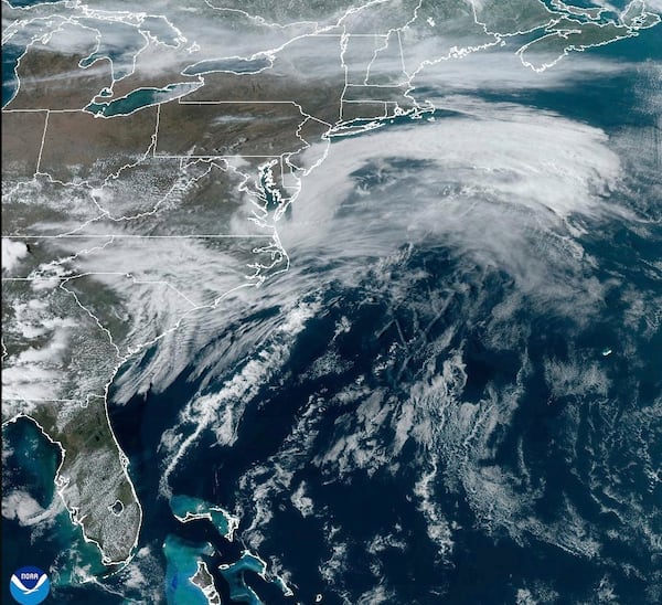 This satellite image from NOAA shows a March megastorm building across the United States, Thursday, March 13, 2025. (NOAA via AP)