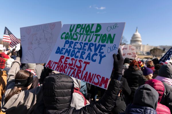 Demonstrators rally during the "No Kings Day" protest on Presidents Day in Washington, in support of federal workers and against recent actions by President Donald Trump and Elon Musk, on Capitol Hill in Washington Monday, Feb. 17, 2025. (AP Photo/Jose Luis Magana)