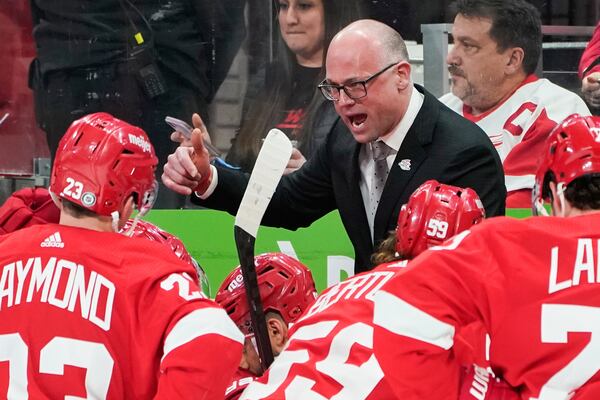 FILE - Detroit Red Wings head coach Jeff Blashill talks to his team during a time out in the second period of an NHL hockey game against the Arizona Coyotes, Tuesday, March 8, 2022, in Detroit. (AP Photo/Paul Sancya, File)