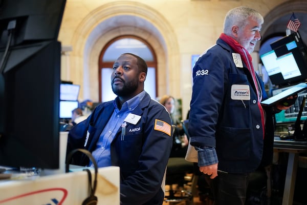 Traders work on the floor at the New York Stock Exchange in New York, Wednesday, Jan. 29, 2025. (AP Photo/Seth Wenig)