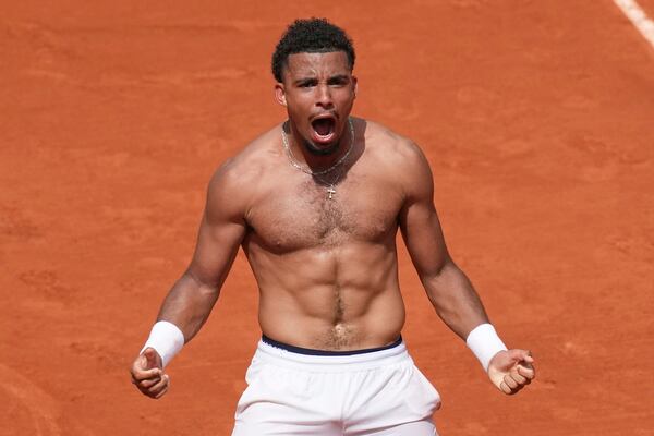 France's Arthur Fils celebrates beating Spain's Jaume Munar after their second round match of the French Tennis Open, at the Roland-Garros stadium, in Paris, Thursday, May 29, 2025. (AP Photo/Christophe Ena)