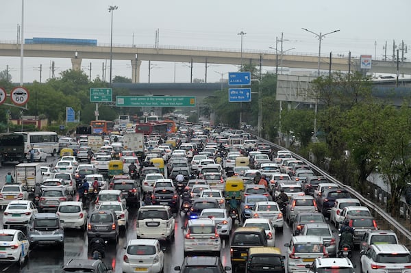 FILE - Vehicles are stuck in traffic on a highway near the Indira Gandhi International Airport after a heavy downpour disrupted vehicular movement in New Delhi, India, June 28, 2024. (AP Photo, File)