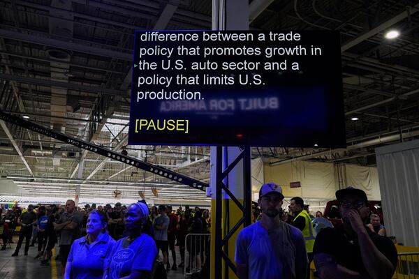 A scrolling teleprompter for Jim Farley, President and Chief Executive Officer of Ford, is seen as he speaks at the Ford Motor Company Kentucky Truck Plant about trade policy during the launch of the 2025 Ford Expedition, Wednesday, April 30, 2025, in Louisville, Ky. (AP Photo/Carolyn Kaster)