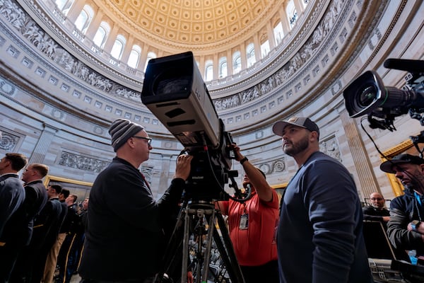 Organizers work to move the Inauguration Day swearing-in ceremony into the Capitol Rotunda due to expected frigid weather in Washington, Saturday, Jan. 18, 2025. (AP Photo/J. Scott Applewhite)