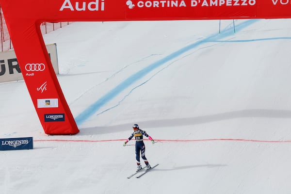 United States' Lindsey Vonn crosses the finish line after crashing during an alpine ski, women's World Cup Super-G, in Cortina d'Ampezzo, Italy, Sunday, Jan. 19, 2025 (AP Photo/Alessandro Trovati)