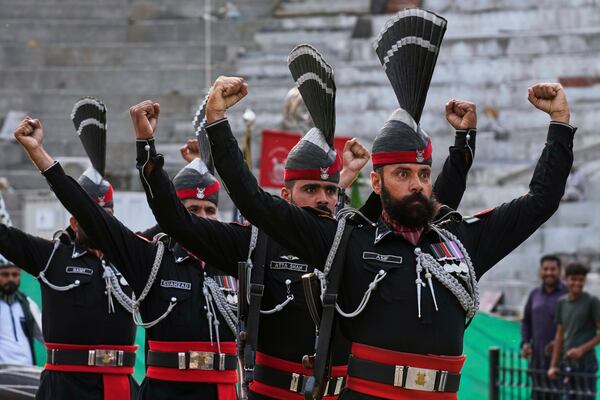 Pakistan's Rangers soldiers gesture during a daily closing ceremony at the Wagah, a joint post on the Pakistan and India border, near Lahore, Pakistan, Saturday, May 3, 2025. (AP Photo/K.M. Chaudary)
