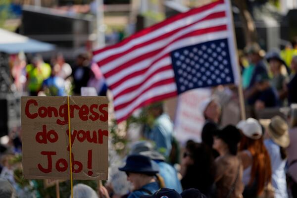 Demonstrators gather during a May Day protest at the Capitol, Thursday, May 1, 2025, in Phoenix. (AP Photo/Matt York)