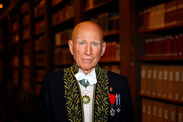 FILE - Photographer Sebastiao Salgado poses for a photo after his election to the French Academy of Fine Arts during a ceremony in Paris, Dec. 6, 2017. Salgado, known for his long-term projects and images of nature and humanity, died at age 81, the Instituto Terra confirmed on Friday, May 23, 2025. (AP Photo/Francois Mori, File)