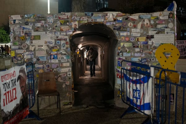 A man walks through a tunnel symbolising the Hamas tunnels, amidst the ongoing conflict between Israel and Hamas, in Tel Aviv, Israel, Wednesday, Jan. 1, 2025. (AP Photo/Matias Delacroix)