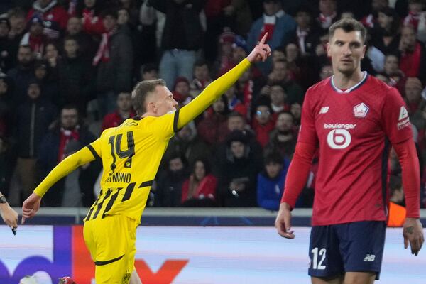 Dortmund's Maximilian Beier celebrates after scoring during the Champions League round of 16 second leg soccer match between Lille and Borussia Dortmund in Villeneuve-d'Ascq , Wednesday, March 12, 2025. (AP Photo/Michel Euler)