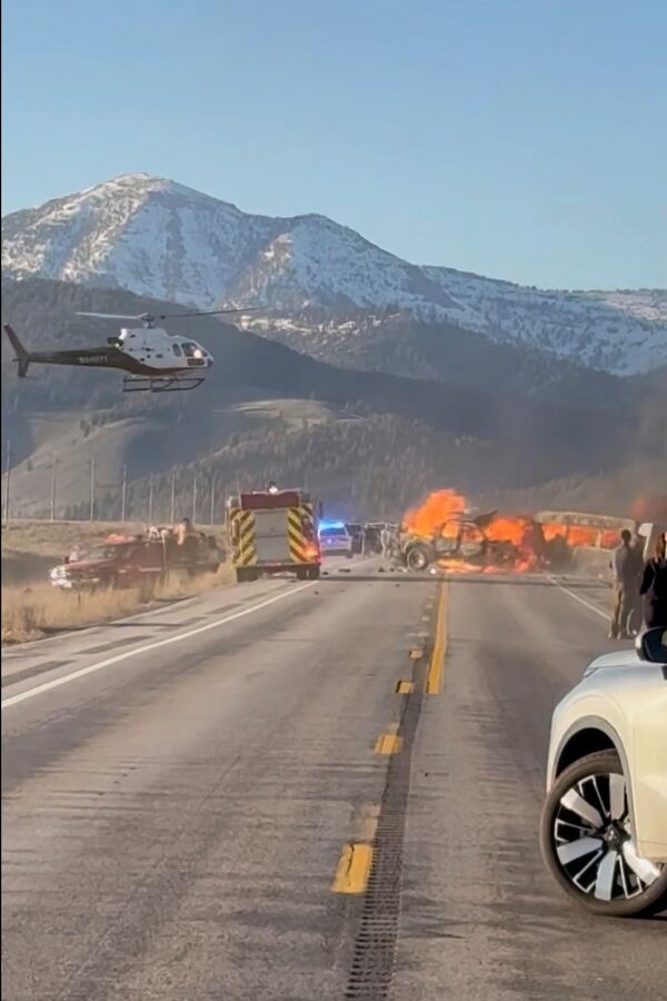 Rescue workers arrive to the scene after a deadly collision between a pickup truck and tour van near Henry’s Lake State Park in eastern Idaho on Thursday, May 1, 2025. (Roger Merrill via AP)