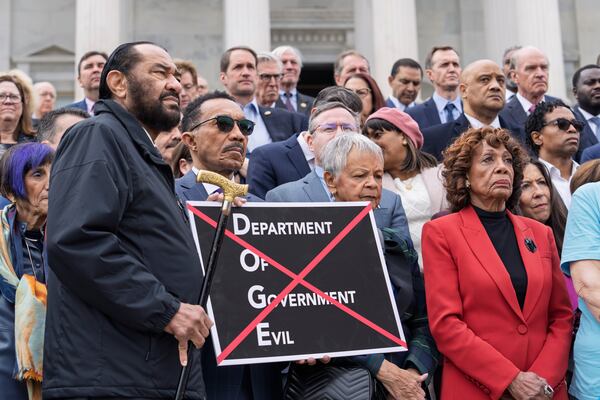 From left, Rep. Al Green, D-Texas, Rep. Kweisi Mfume, D-Md., Rep. Bonnie Watson Coleman, D-N.J., and Rep. Maxine Waters, D-Calif., join others as House Minority Leader Hakeem Jeffries, D-N.Y., speaks out against the Republican budget plan, on the House steps at the Capitol in Washington, Tuesday, Feb. 25, 2025. (AP Photo/J. Scott Applewhite)