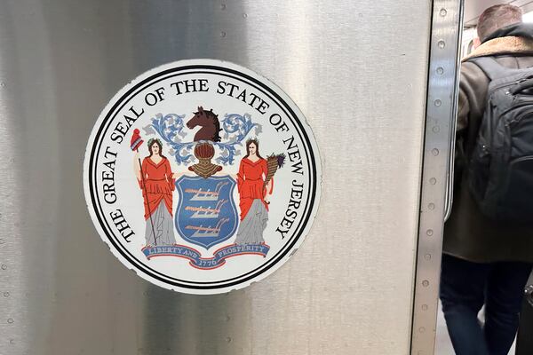 FILE - The seal of the state of New Jersey is on a New Jersey Transit train in Secaucus, New Jersey, on Saturday, December 23, 2023. (AP Photo/Ted Shaffrey, File)