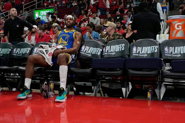 Golden State Warriors guard Buddy Hield (7) sits on the bench during the second half of Game 5 of an NBA basketball first-round playoff series against the Houston Rockets, Wednesday, April 30, 2025, in Houston. (AP Photo/David J. Phillip)
