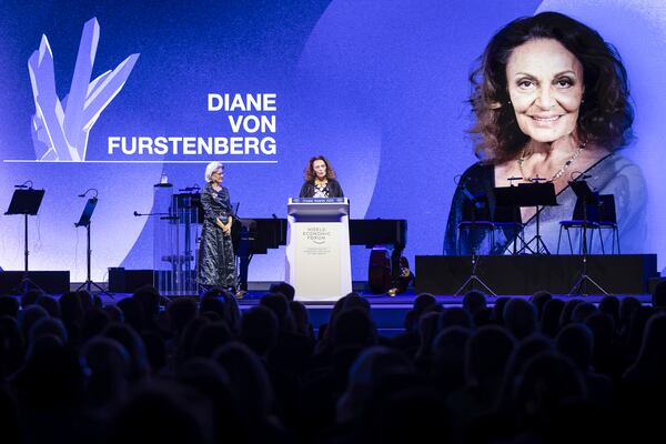 Diane von Furstenberg, Founder and Co-Chairwoman, Diane Von Furstenberg Studio, center, speaks after receiving a Crystal Award from Hilde Schwab, Chairperson and Co-Founder, Schwab Foundation for Social Entrepreneurship, during the ceremony for the Crystal Awards at the 55th annual meeting of the World Economic Forum, WEF, in Davos, Switzerland, on Monday, Jan. 20, 2025. (Michael Buholzer/Keystone via AP)