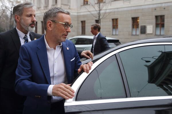 The leader of Austria's Freedom Party, Herbert Kickl, arrives at his party's headquarters in Vienna, Austria, Wednesday, Feb. 12, 2025. (AP Photo/Heinz-Peter Bader)