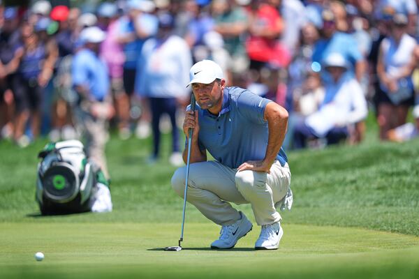 Scottie Scheffler prepares to putt on the first hole during the final round of the CJ Cup Byron Nelson golf tournament in McKinney, Texas, Sunday, May 4, 2025. (AP Photo/LM Otero)