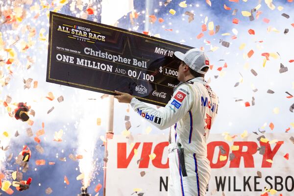 Christopher Bell celebrates after winning the NASCAR All-Star auto race Sunday, May 18, 2025, in North Wilkesboro, N.C. (AP Photo/Scott Kinser)