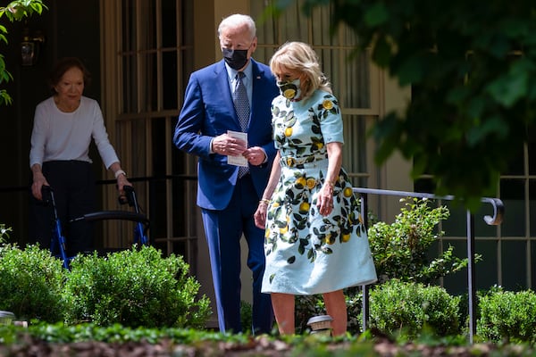 FILE - Former first lady Rosalynn Carter looks on as President Joe Biden and first lady Jill Biden leave the home of former President Jimmy Carter during a trip to mark Biden's 100th day in office, Thursday, April 29, 2021, in Plains, Ga. (AP Photo/Evan Vucci, File)