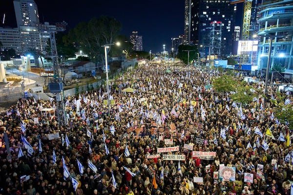 People take part in a protest demanding the immediate release of hostages held by Hamas in the Gaza Strip, in Tel Aviv, Israel, Saturday, March 22, 2025. (AP Photo/Ohad Zwigenberg)