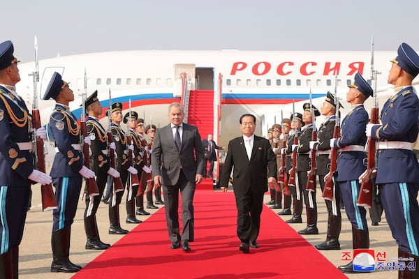 This photo provided by the North Korean government shows Russia's Security Council secretary, Sergey Shoigu, center left, who arrived at Pyongyang Airport being received by Party Secretary Park Chung-cheon, center right on Friday, March 21, 2025. Independent journalists were not given access to cover the event depicted in this image distributed by the North Korean government. The content of this image is as provided and cannot be independently verified. Korean language watermark on image as provided by source reads: "KCNA" which is the abbreviation for Korean Central News Agency. (Korean Central News Agency/Korea News Service via AP)