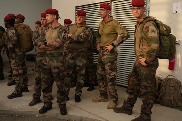 French troops arrive to give support Wednesday, Dec. 18, 2024 in the French Indian Ocean island of Mayotte. (AP Photo/Adrienne Surprenant)